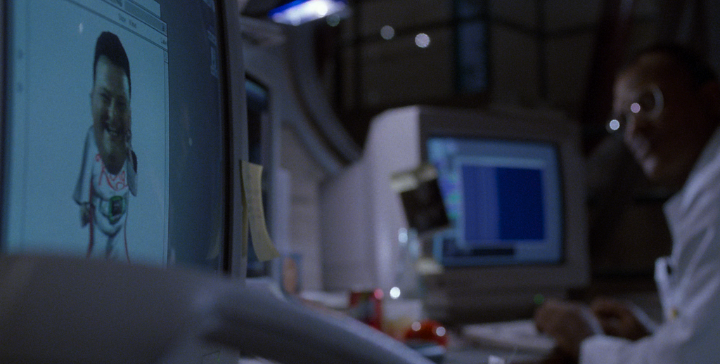 A scene from Jurassic Park with a character working at a computer